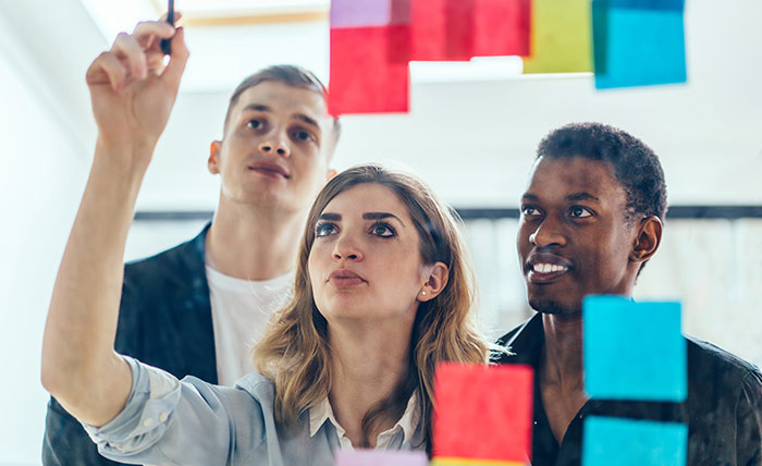 People working on a whiteboard